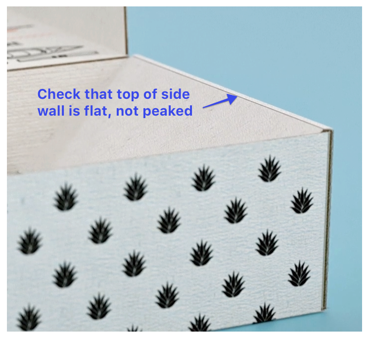 Check that top of side wall is flat, not peaked